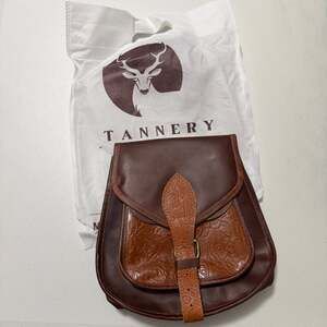 The Tannery Genuine Leather Saddle Crossbody Bag with Embossing